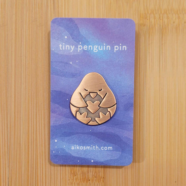 Copper Penguin Pin on backing card Copper Penguin Pin on backing card